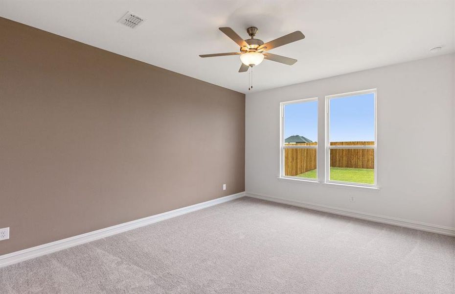Primary suite with large windows
