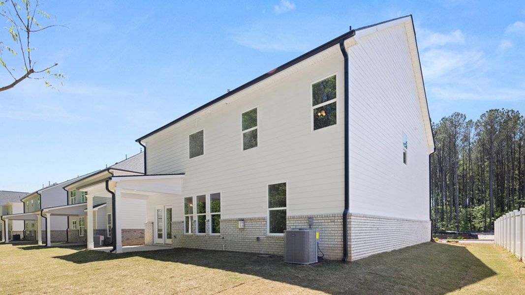 Front exterior of a new home in Wildwood, Covington, GA, highlighting curb appeal (Image 1).