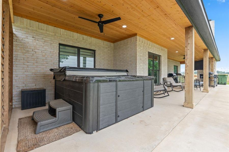 Patio with Privacy wall.  View of Pasture from Hot Tub