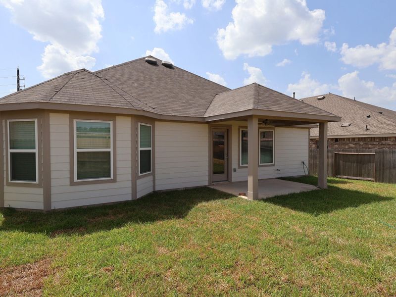 Exterior details and patio area of a home in Magnolia Ridge, Magnolia (Image 3).