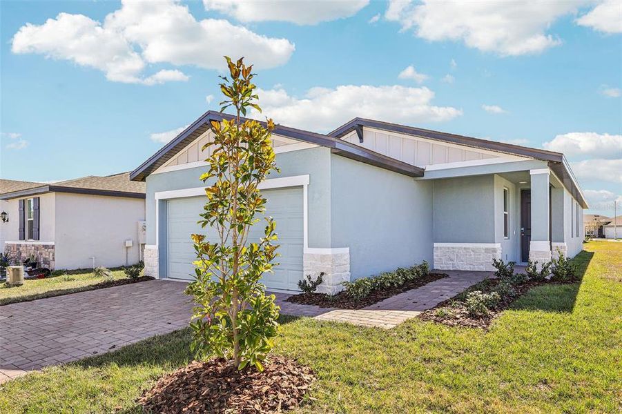 Front exterior of a new home in Lake Deer Estates - Classic Series, Poinciana, FL, highlighting curb appeal (Image 19).