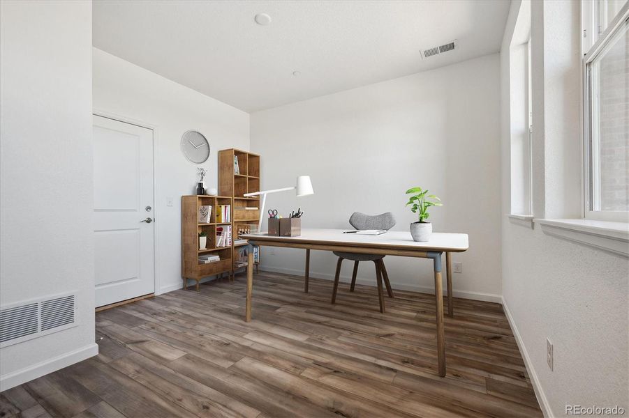 Furnished interior view inside a new home in Atlantic Collection at The Townes at Skyline Ridge, Castle Pines (Image 7).
