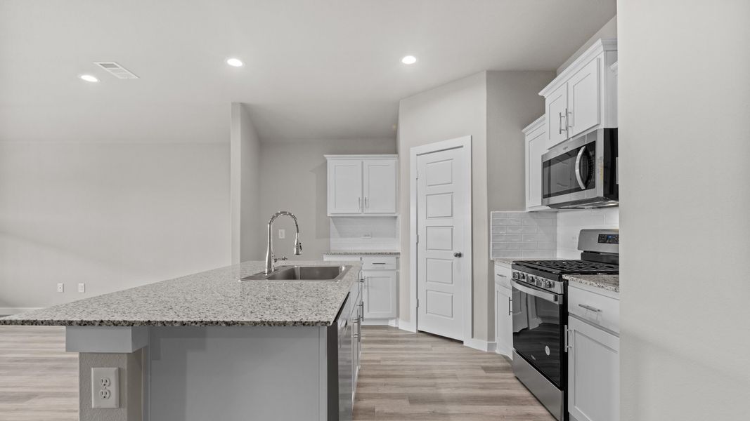 Representative furnished interior of a home built from the JUSTIN by D.R. Horton in Homestead at Parks Bell Ranch, Odessa (Image 9).