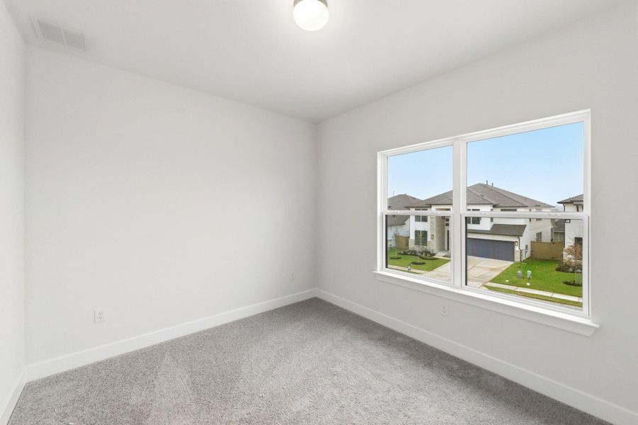 Spacious, unfurnished interior of a new home in The Colony, Bastrop (Image 16).