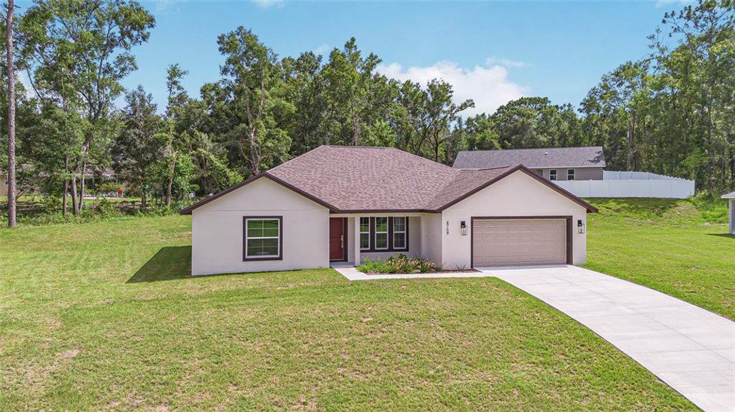 Front exterior of a new home in , Citrus Springs, FL, highlighting curb appeal (Image 19). Front exterior of a new home in , Citrus Springs, FL, highlighting curb appeal (Image 19).