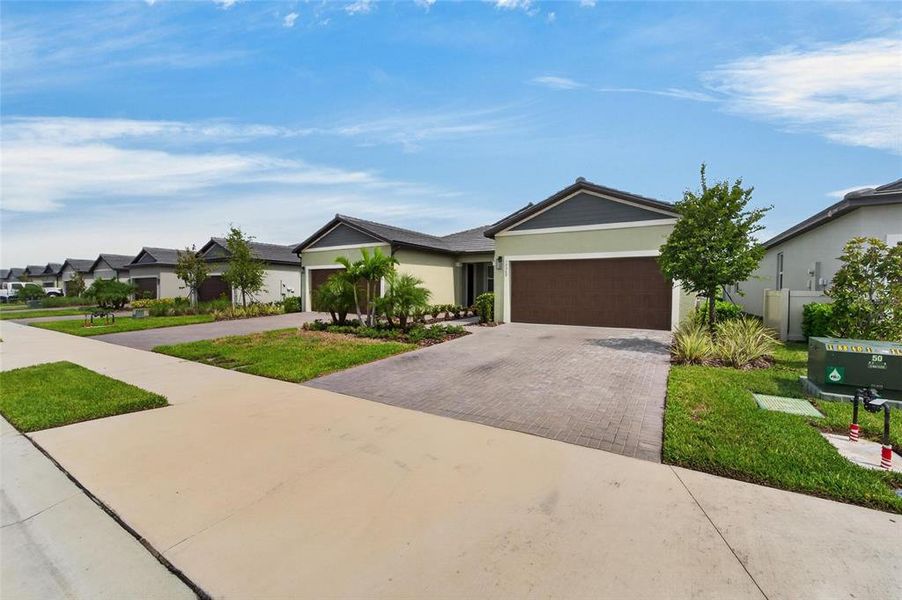 Front exterior of a new home in , Parrish, FL, highlighting curb appeal (Image 24).