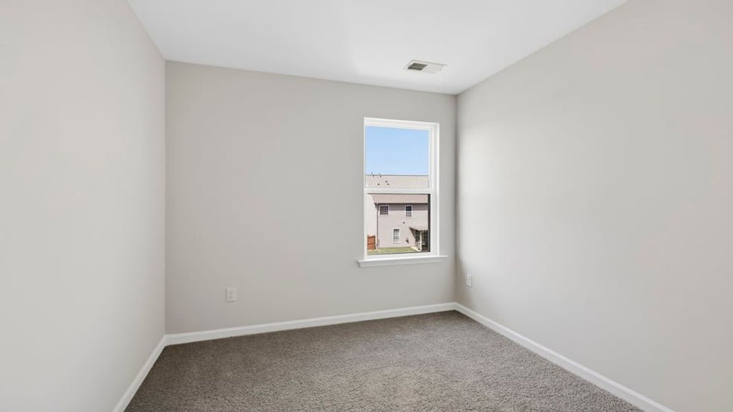Spacious, unfurnished interior of a new home in Tanglewood Townes, Greenville (Image 23).