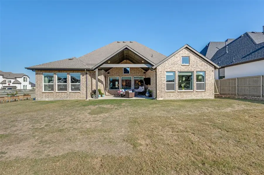 Exterior details and patio area of a home in Pecan Square - Estates, Northlake (Image 3).
