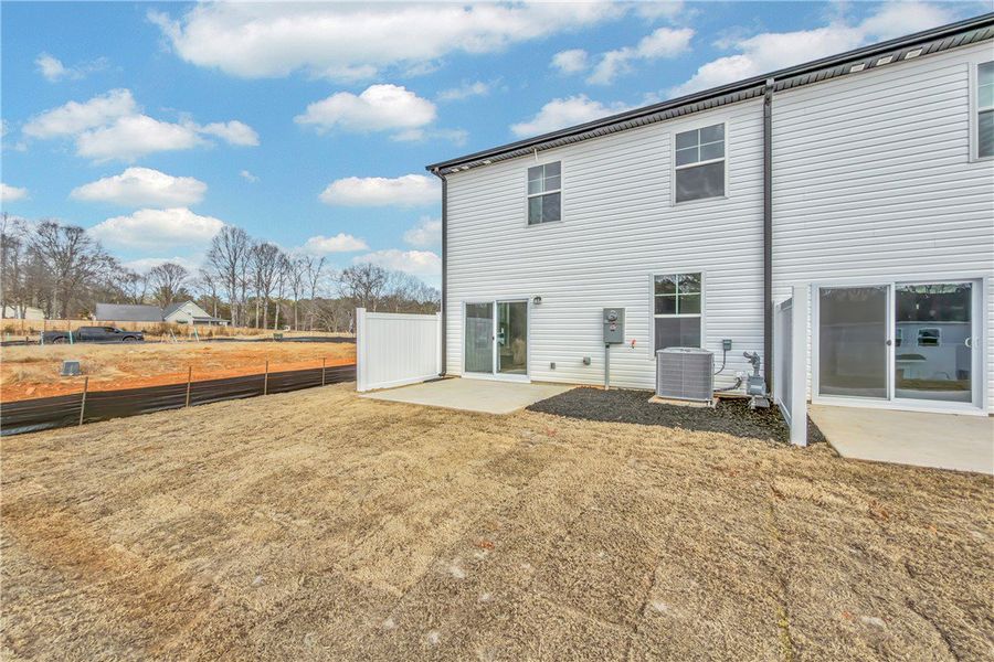 This newly constructed home features a private pat