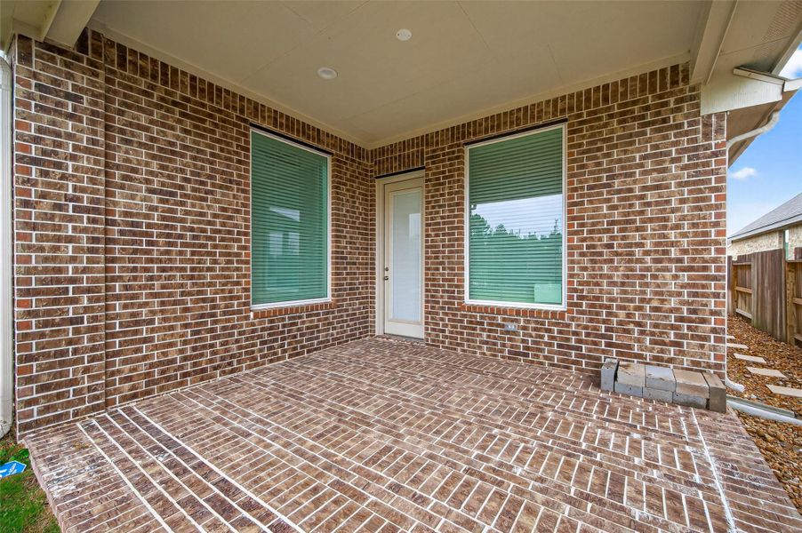 Exterior details and patio area of a home in Artavia, Conroe (Image 25).