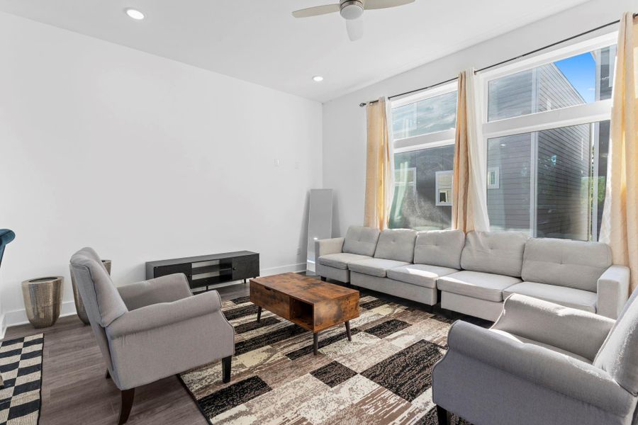 Bright living area filled with natural light and modern finishes.