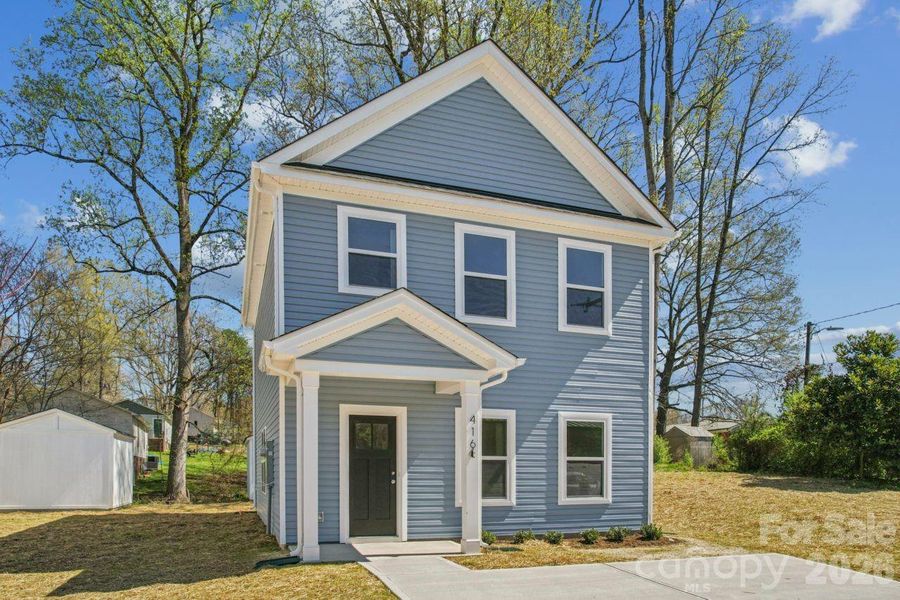 Front exterior of a new home in , Bessemer City, NC, highlighting curb appeal (Image 17).