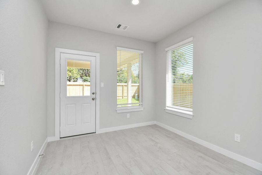 Enjoy breakfast with ease in the connected and cozy breakfast area, seamlessly integrated with the kitchen for utmost convenience. Step through the back door for a breath of fresh air onto the covered patio, extending your living space to the outdoors. Sample photo of completed home with similar floor plan. Actual colors and selections may vary. Enjoy breakfast with ease in the connected and cozy breakfast area, seamlessly integrated with the kitchen for utmost convenience. Step through the back door for a breath of fresh air onto the covered patio, extending your living space to the outdoors. Sample photo of completed home with similar floor plan. Actual colors and selections may vary.