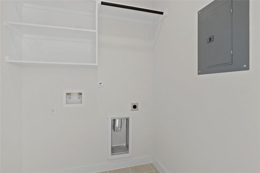 Utility room in the Pecan II home plan by Trophy Signature Homes – REPRESENTATIVE PHOTO Utility room in the Pecan II home plan by Trophy Signature Homes – REPRESENTATIVE PHOTO