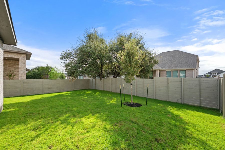 Exterior details and patio area of a home in Wolf Ranch, Georgetown (Image 28).