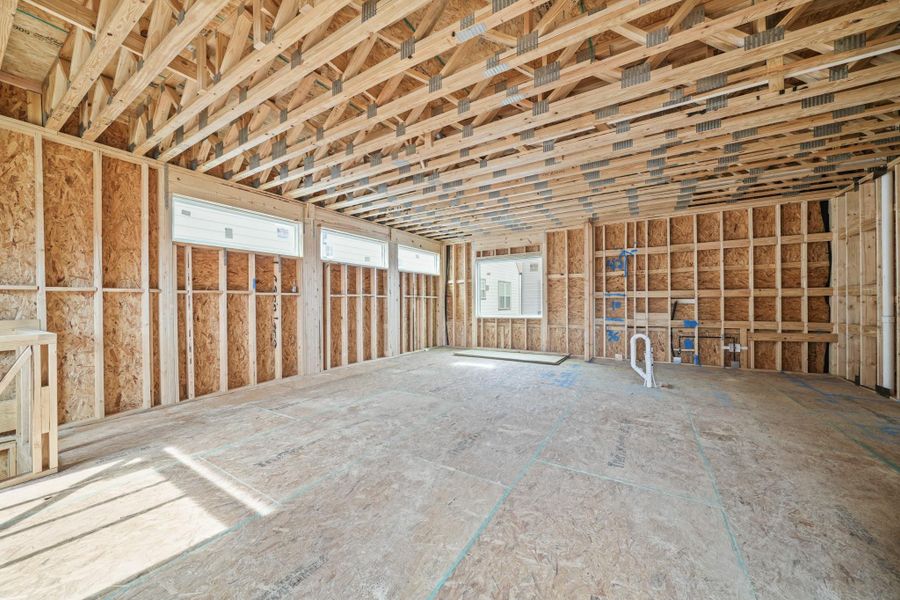 Another view of the second floor living area with the large fixed window and the three large transom windows allowing in an abundance of natural light. Another view of the second floor living area with the large fixed window and the three large transom windows allowing in an abundance of natural light.