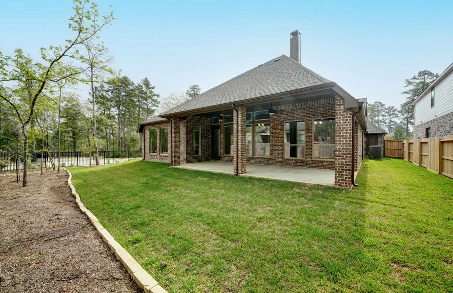 Representative exterior details of a home built from the 3030 by Ravenna Homes in The Woodlands Hills 65′, Willis (Image 25). Representative exterior details of a home built from the 3030 by Ravenna Homes in The Woodlands Hills 65′, Willis (Image 25).