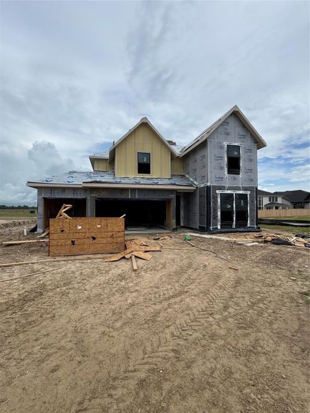 Front exterior of a new home in Bridgeland 45', 50', 70', Cypress, TX, highlighting curb appeal (Image 1).