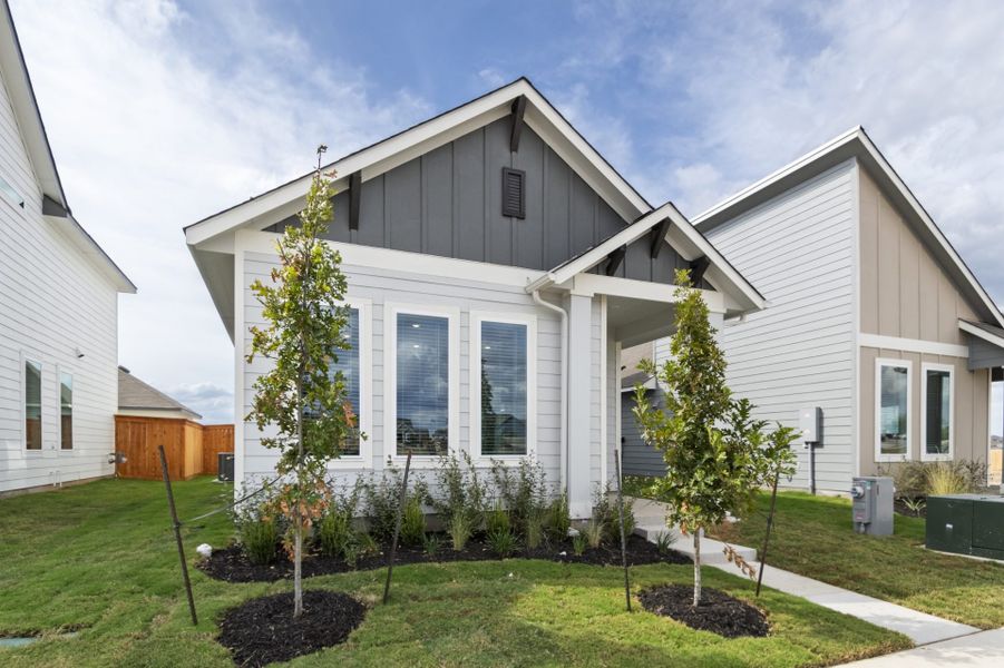 Front exterior of a new home in Trace, San Marcos, TX, highlighting curb appeal (Image 28).