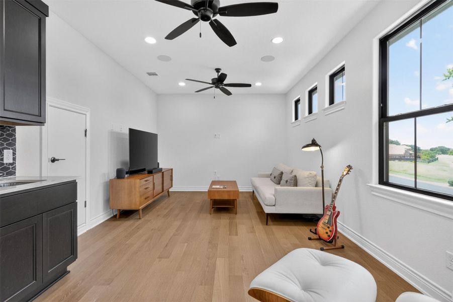 A welcoming living area with rich hardwood floors and recessed lighting, perfect for entertaining. A welcoming living area with rich hardwood floors and recessed lighting, perfect for entertaining.