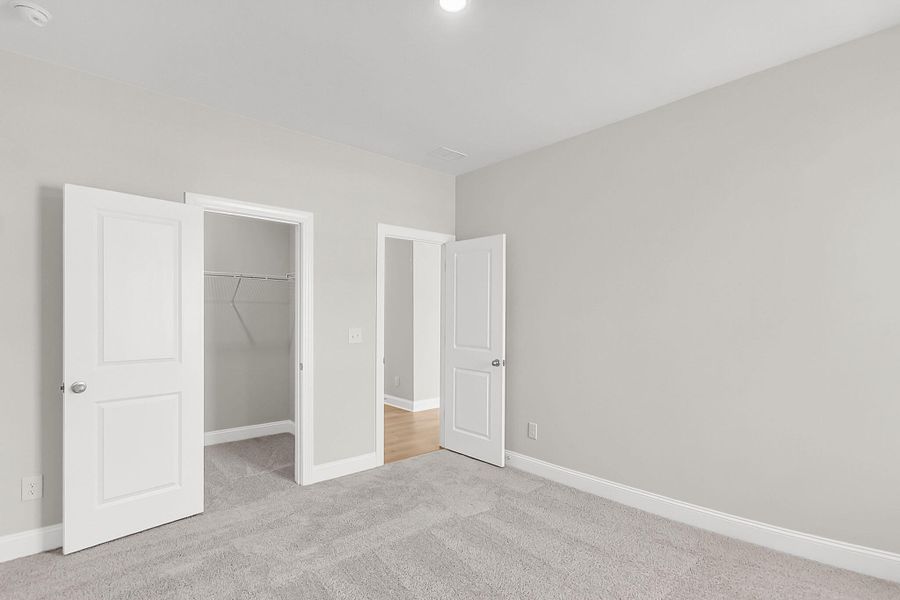 Spacious, unfurnished interior of a new home in Tidewater at Lakes of Cane Bay, Summerville (Image 43).