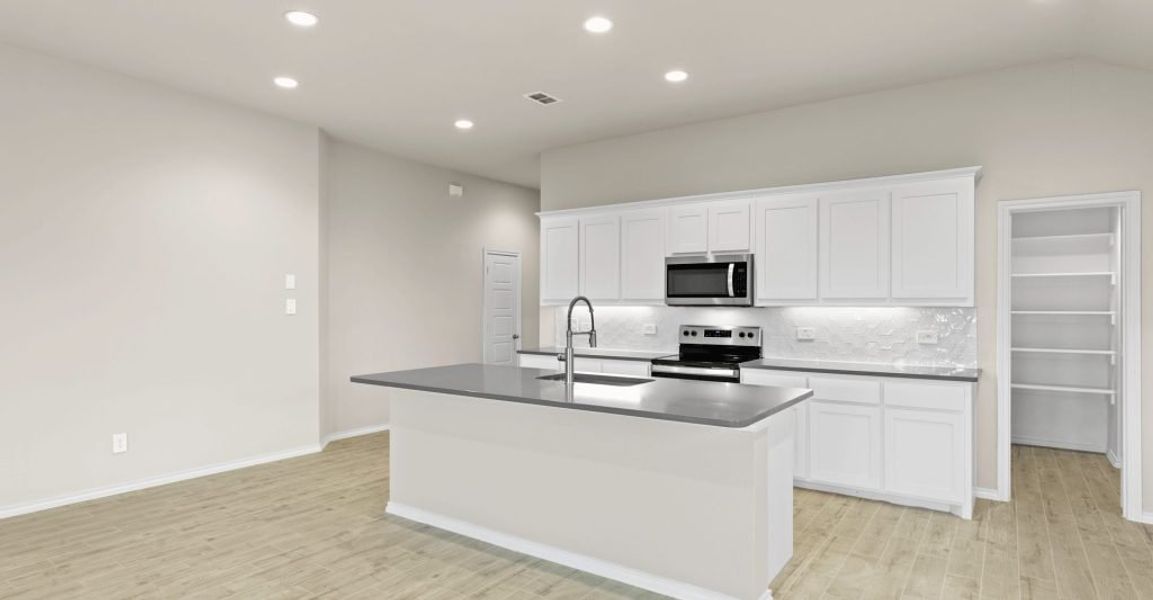 Representative exterior photo of a completed home built from the Lincoln by Impression Homes in Keeneland, Aubrey, TX (Image 6). Representative exterior photo of a completed home built from the Lincoln by Impression Homes in Keeneland, Aubrey, TX (Image 6).