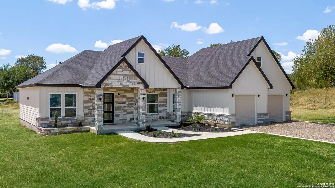 Front exterior of a new home in , Lytle, TX, highlighting curb appeal (Image 2). Front exterior of a new home in , Lytle, TX, highlighting curb appeal (Image 2).