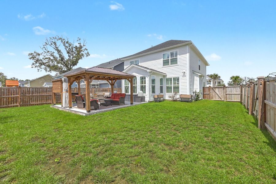 Exterior details and patio area of a home in , Johns Island (Image 27).