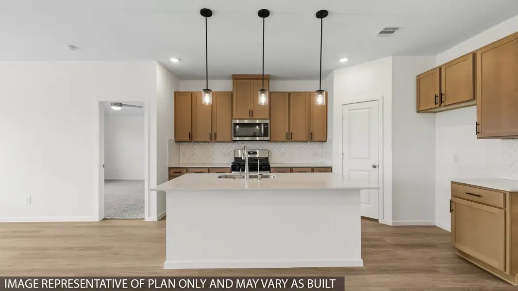 Furnished interior view inside a new home in Sunterra, Katy (Image 4).