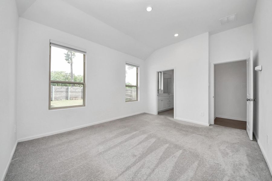 Primary Bedroom with ensuite bath and large walkin closet.
