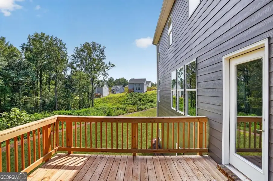 Exterior details and patio area of a home in Austin Ridge, Commerce (Image 4).