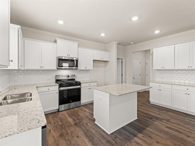 Furnished interior view inside a new home in Northwoods at Mirror Lake, Villa Rica (Image 4).