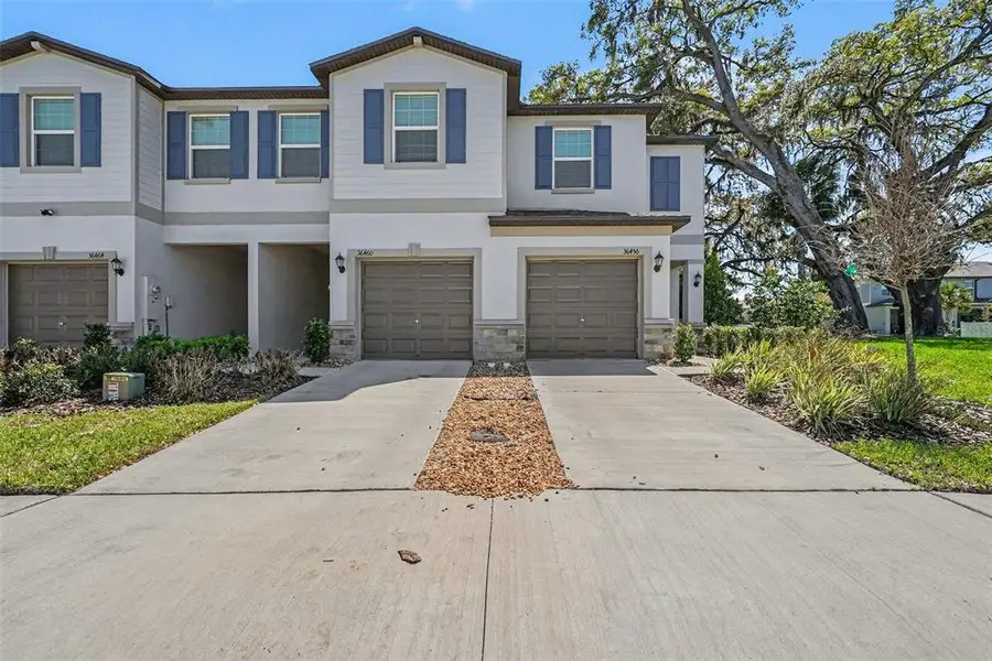 Front exterior of a new home in , Zephyrhills, FL, highlighting curb appeal (Image 18).