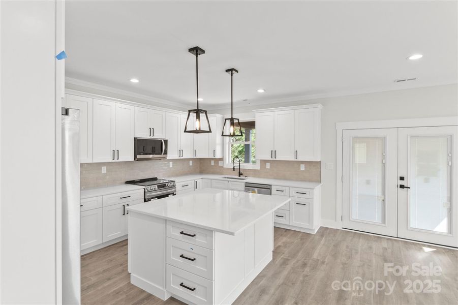 Very large and open kitchen with a ton of cabinet and counter top space. Over size island with drawers and cabinets on three sides. Extra storage.All soft close darwaers and cabinets