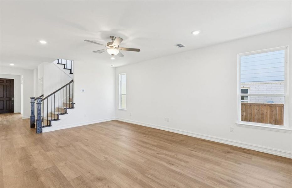 Airy gathering room showcases open concept floorplan