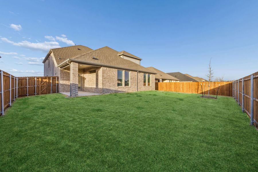 Covered Patio in the Wimbledon home plan by Trophy Signature Homes – REPRESENTATIVE PHOTO