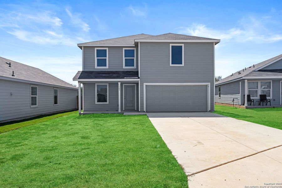 Front exterior of a new home in Lodi Grove, Floresville, TX, highlighting curb appeal (Image 1). Front exterior of a new home in Lodi Grove, Floresville, TX, highlighting curb appeal (Image 1).