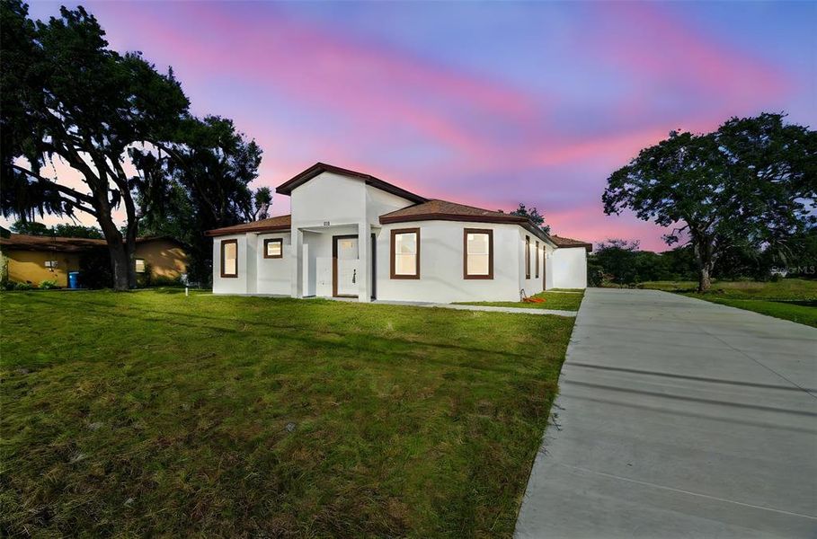 Front exterior of a new home in , Spring Hill, FL, highlighting curb appeal (Image 1).