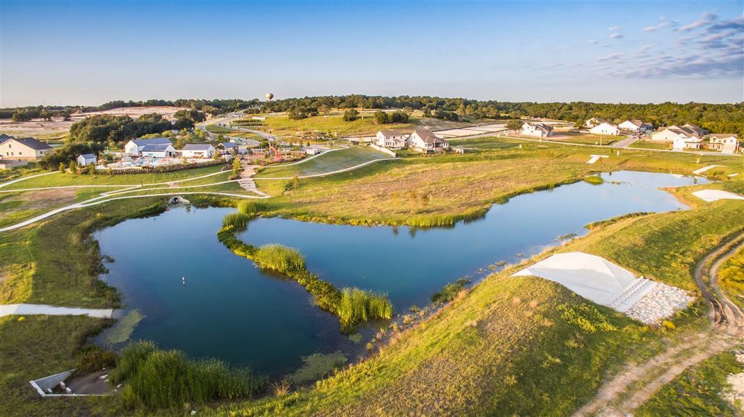 Drone / aerial view featuring a residential view and a water view Drone / aerial view featuring a residential view and a water view