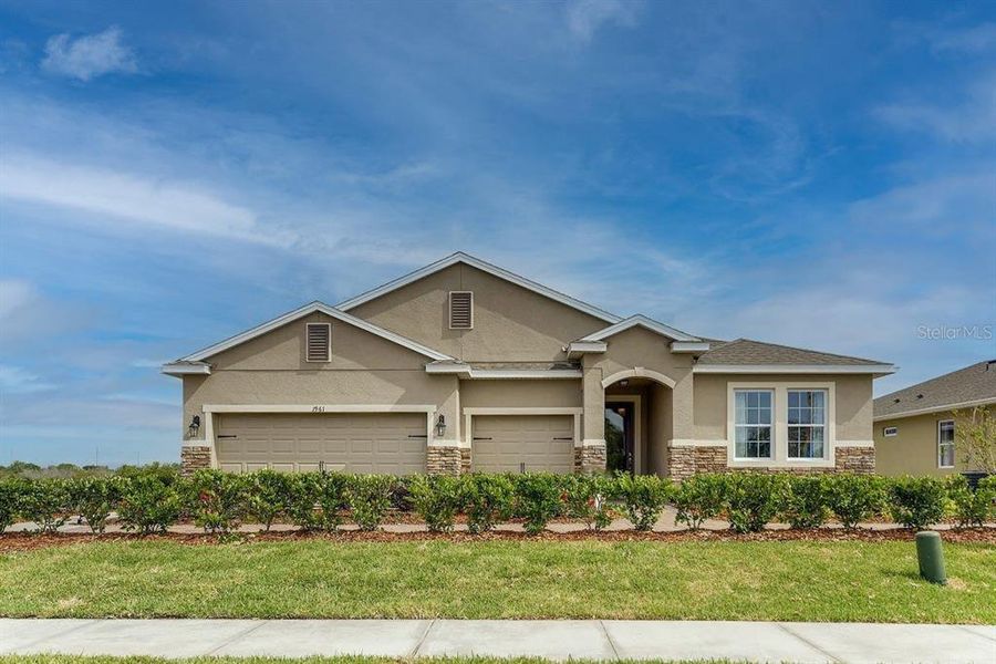 Front exterior of a new home in Harmony West, St. Cloud, FL, highlighting curb appeal (Image 2). Front exterior of a new home in Harmony West, St. Cloud, FL, highlighting curb appeal (Image 2).
