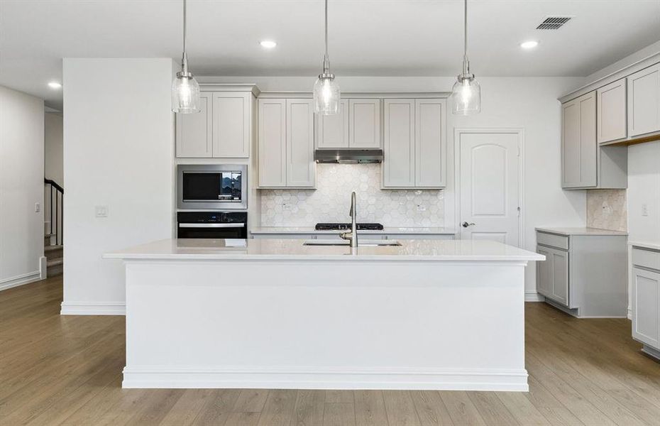 Kitchen with eat-in bartop island