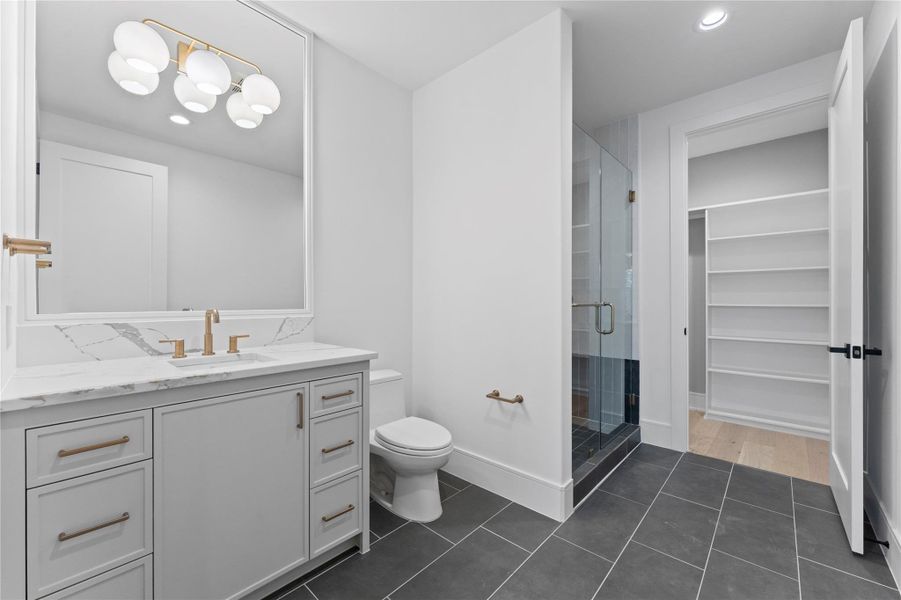 3rd bath and wic, modern vanity with sleek fixtures.