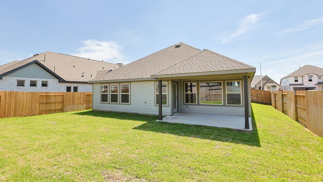 Exterior details and patio area of a home in Sunterra, Katy (Image 3).