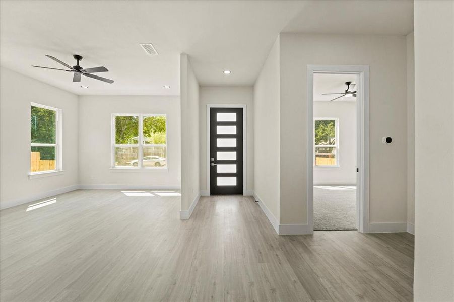 Entryway with a ceiling fan, light wood finished floors, and recessed lighting Entryway with a ceiling fan, light wood finished floors, and recessed lighting