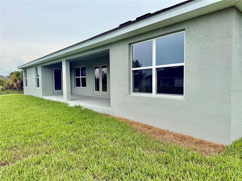 Front exterior of a new home in South Gulf Cove, Port Charlotte, FL, highlighting curb appeal (Image 2).