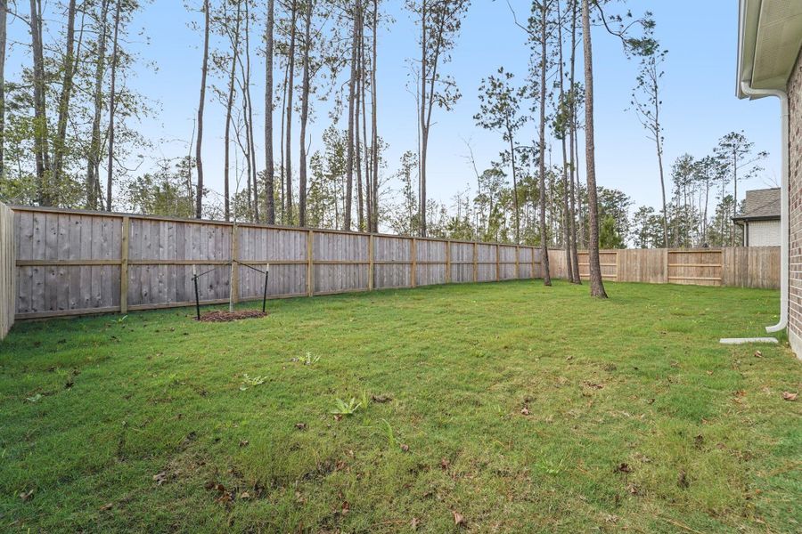 Exterior details and patio area of a home in Evergreen, Conroe (Image 19). Exterior details and patio area of a home in Evergreen, Conroe (Image 19).