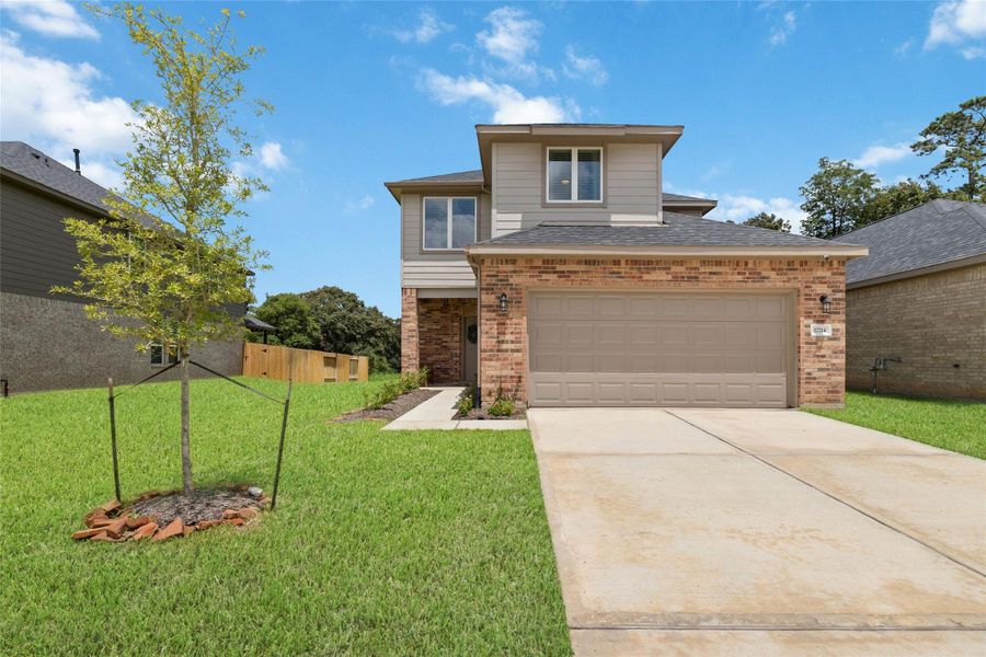 Front exterior of a new home in Rosehill Meadow, Tomball, TX, highlighting curb appeal (Image 2). Front exterior of a new home in Rosehill Meadow, Tomball, TX, highlighting curb appeal (Image 2).