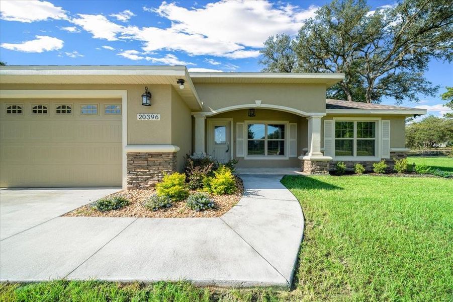 Front exterior of a new home in , Dunnellon, FL, highlighting curb appeal (Image 23).