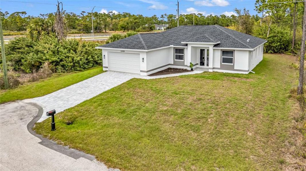 Front exterior of a new home in , Punta Gorda, FL, highlighting curb appeal (Image 27).