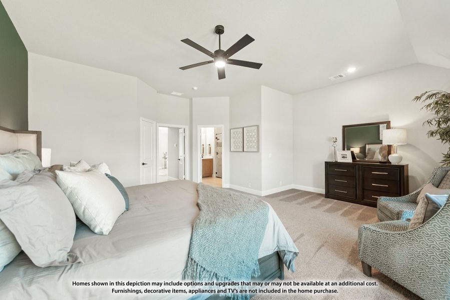 Spacious master bedroom with vaulted ceiling, ceiling fan, carpet flooring, and ensuite bathroom doorway visible. Spacious master bedroom with vaulted ceiling, ceiling fan, carpet flooring, and ensuite bathroom doorway visible.